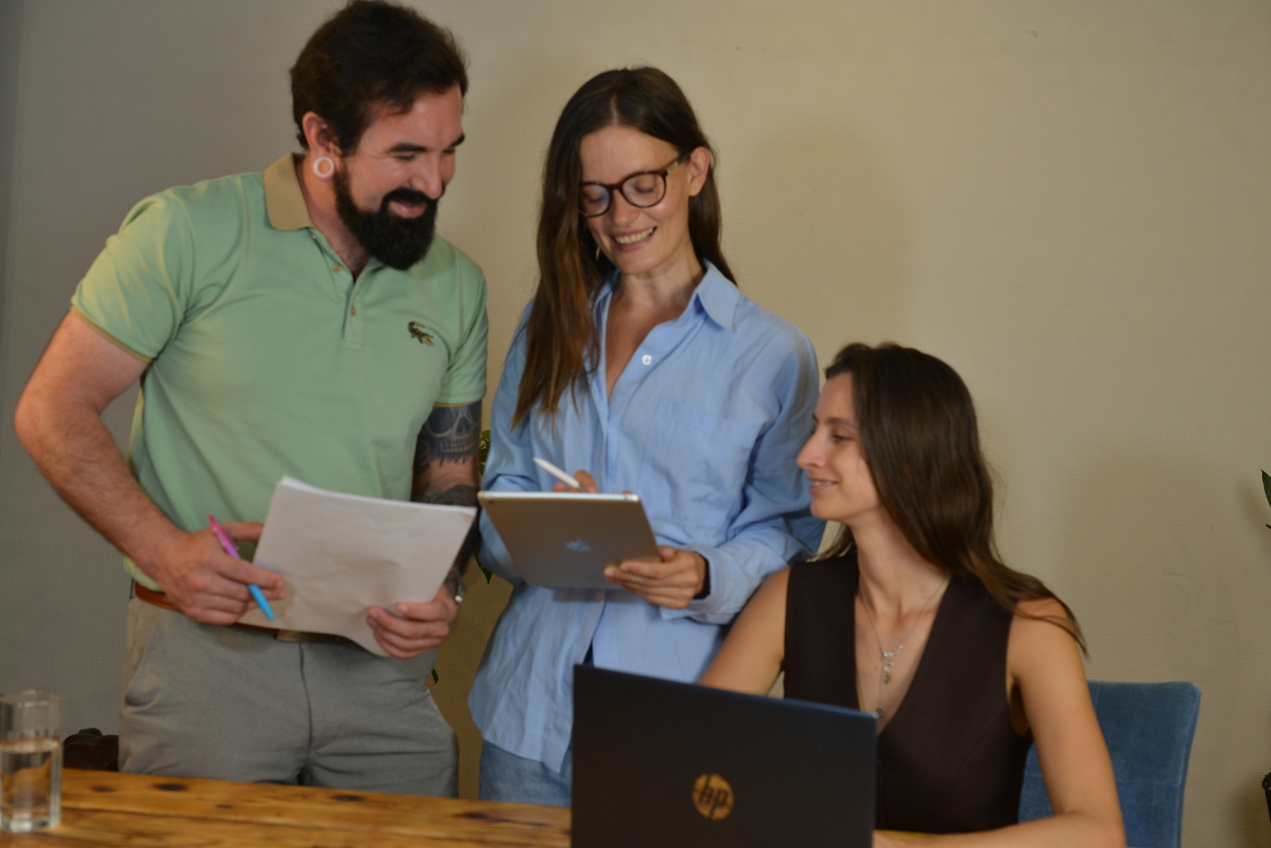 Three team members working together at Axiom Tier